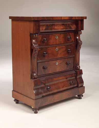 A stained pine miniature Scotch chest of drawers,