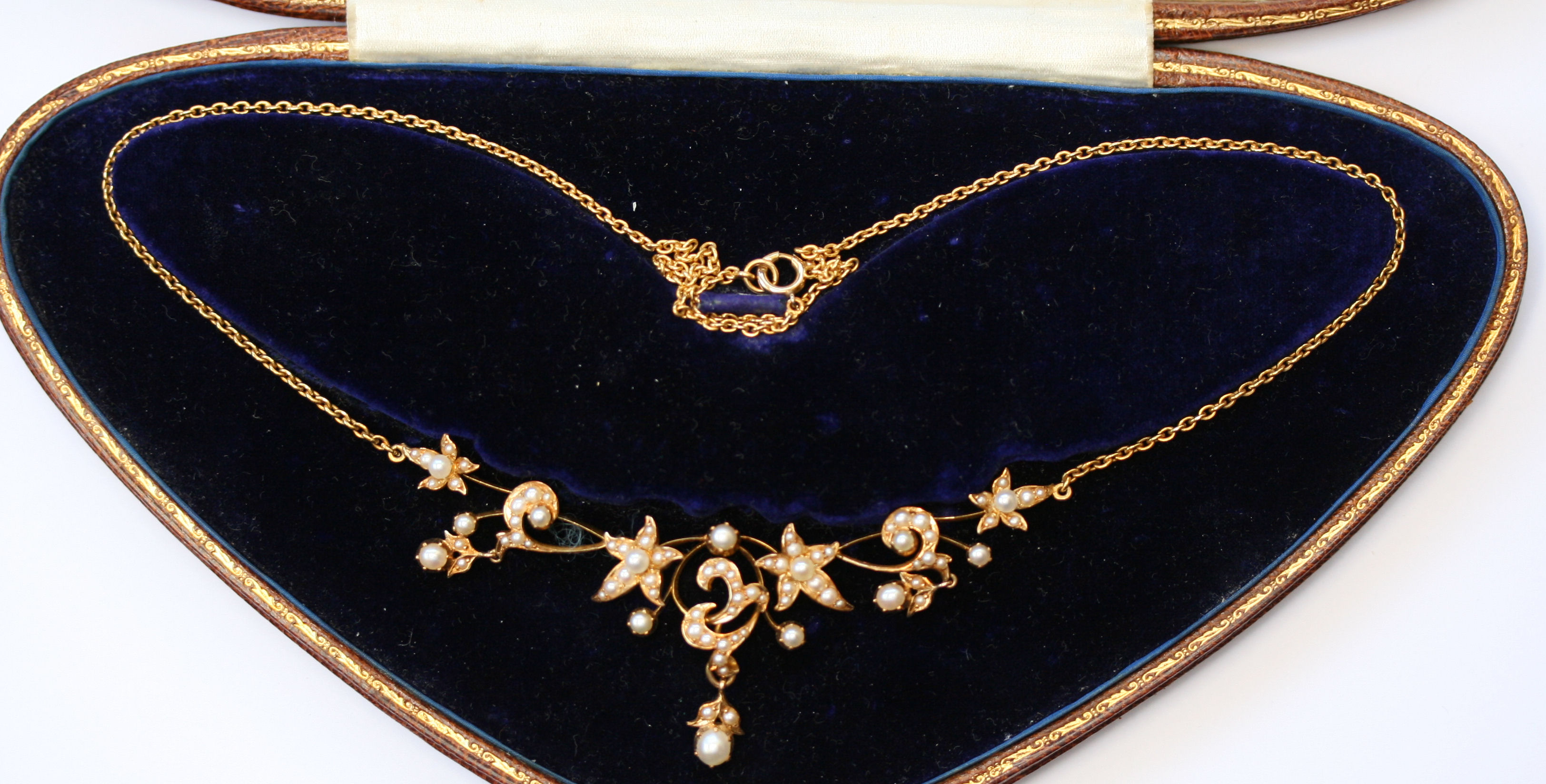 An Edwardian gold and seed pearl set fringe necklace