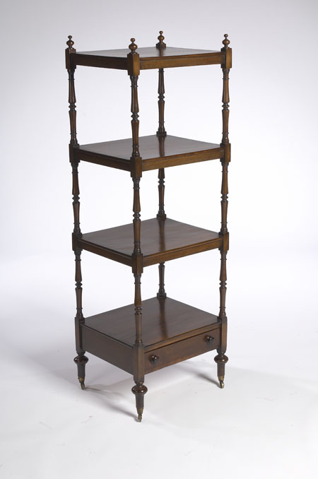 An early 19th century mahogany four tier whatnot