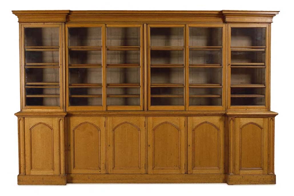 An early Victorian oak reverse breakfront bookcase,