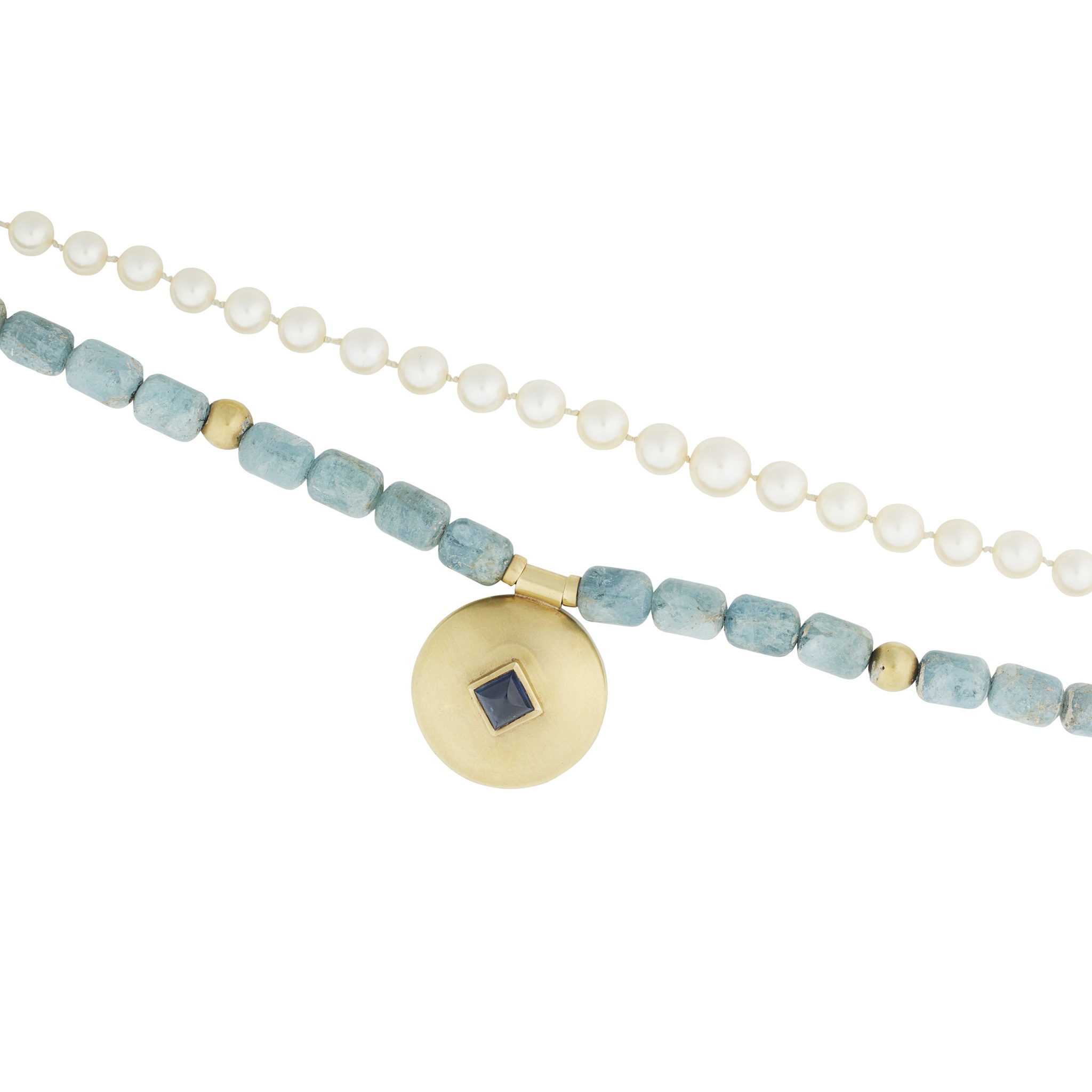 An aquamarine and sapphire set necklace