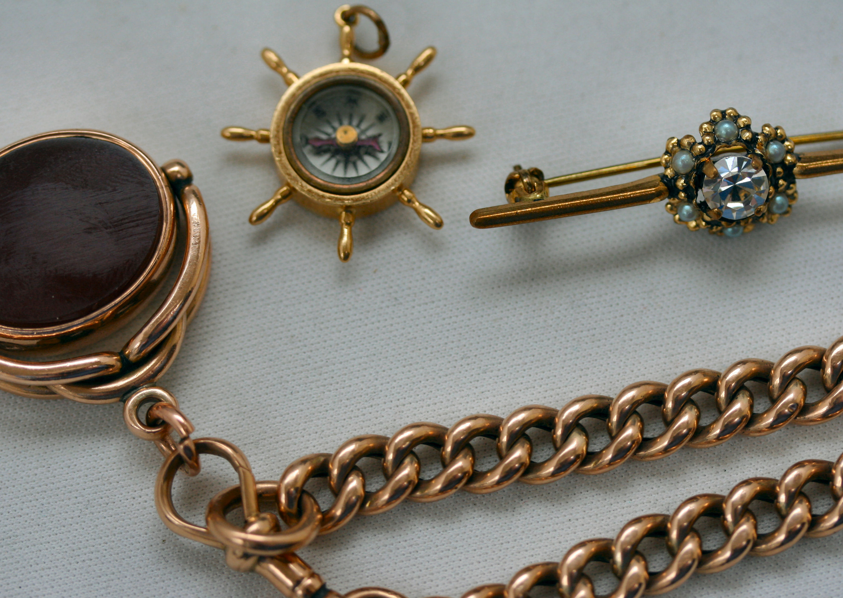 A 9ct rose gold chain and fob