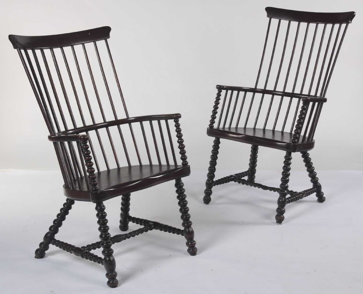 A pair of 19th century elm and beech framed Darvel armchairs