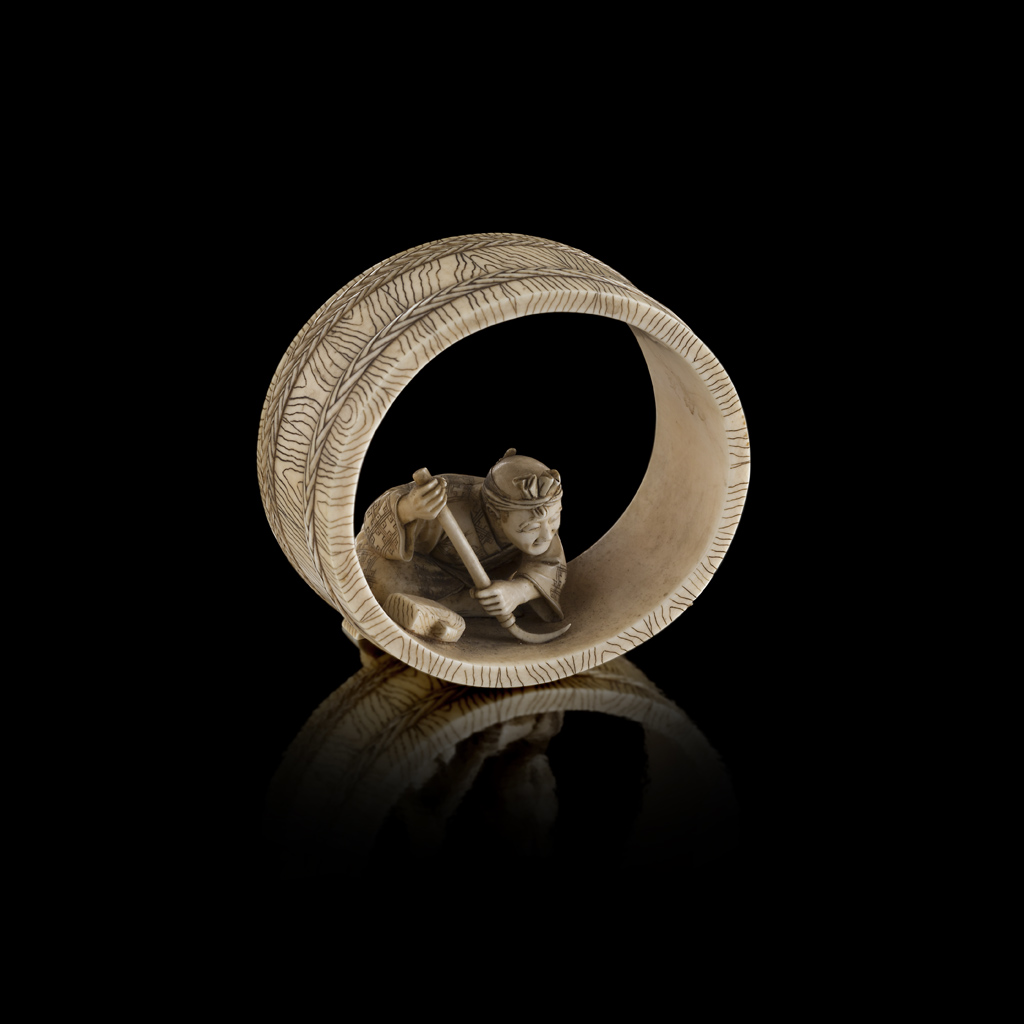 CARVED IVORY OKIMONO OF A COOPER