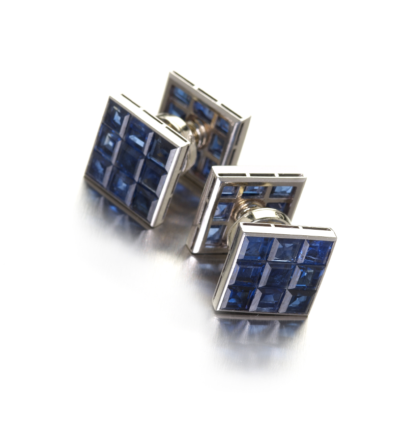 A pair of French white gold and platinum mounted sapphire set cufflinks