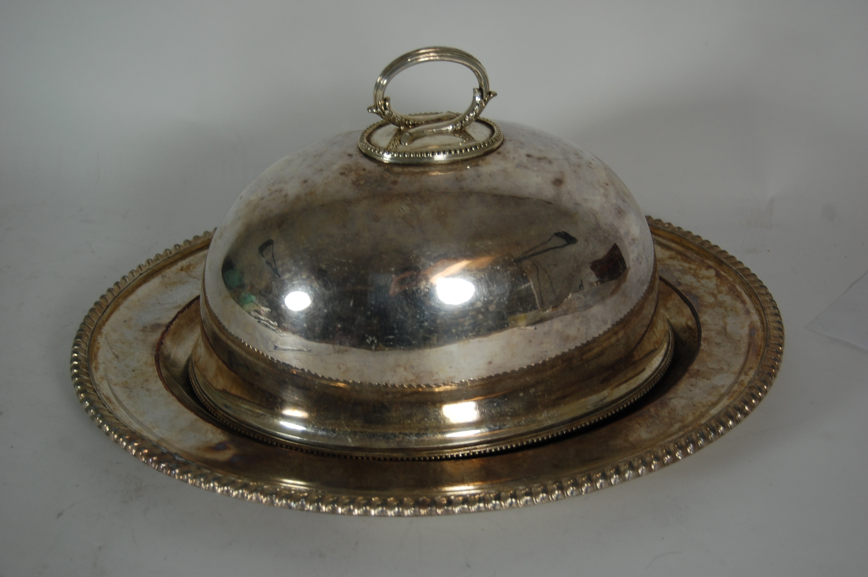 A group of silver plated meat covers