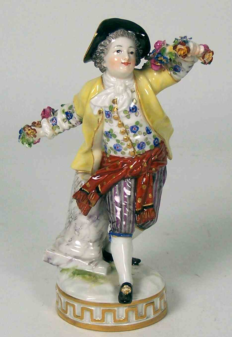 A late 19th/early 20th century Meissen figure of a boy