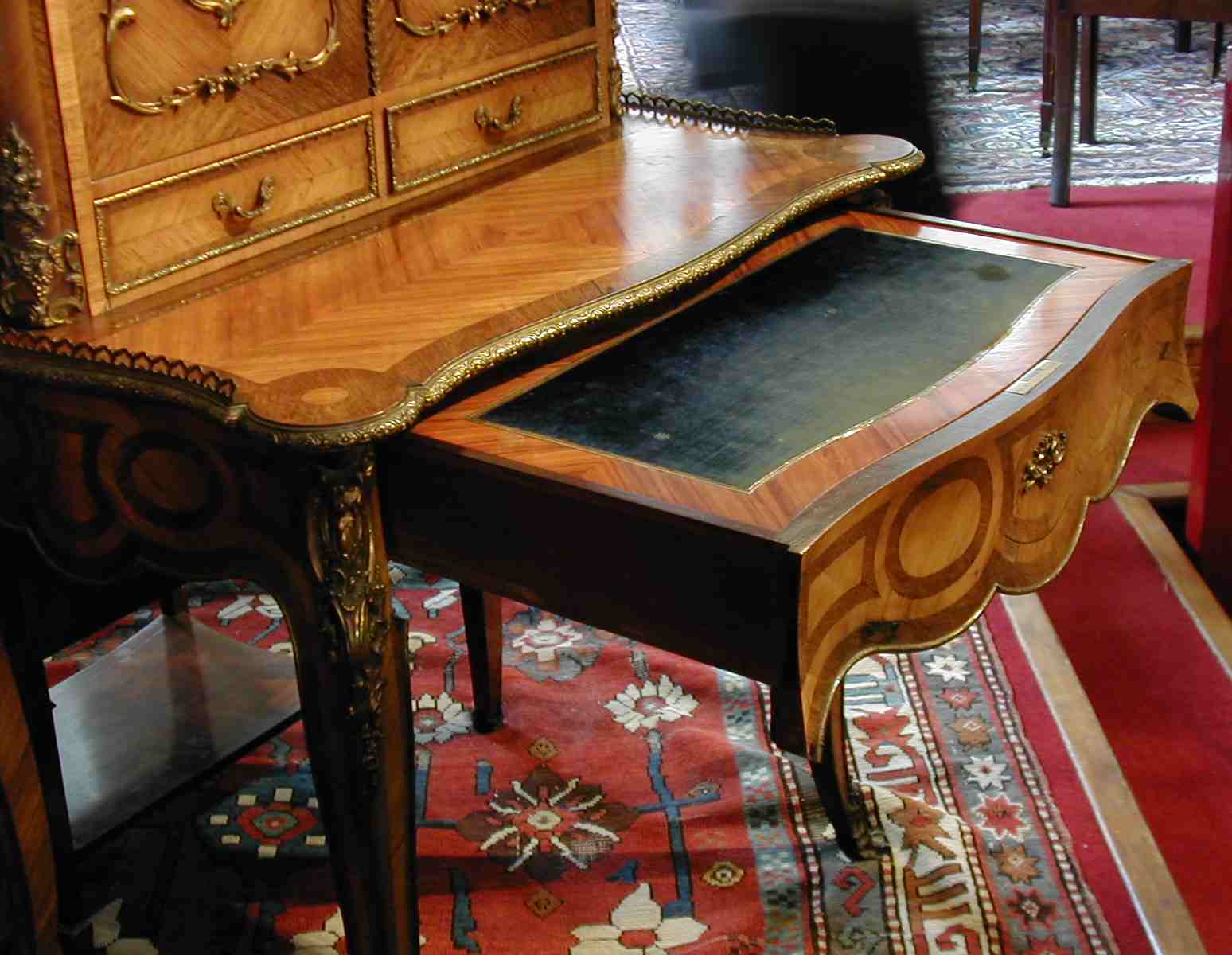 A late 19th century quarter veneered kingwood and tulipwood bonheur-de-jour, stamped Tahan a Paris,