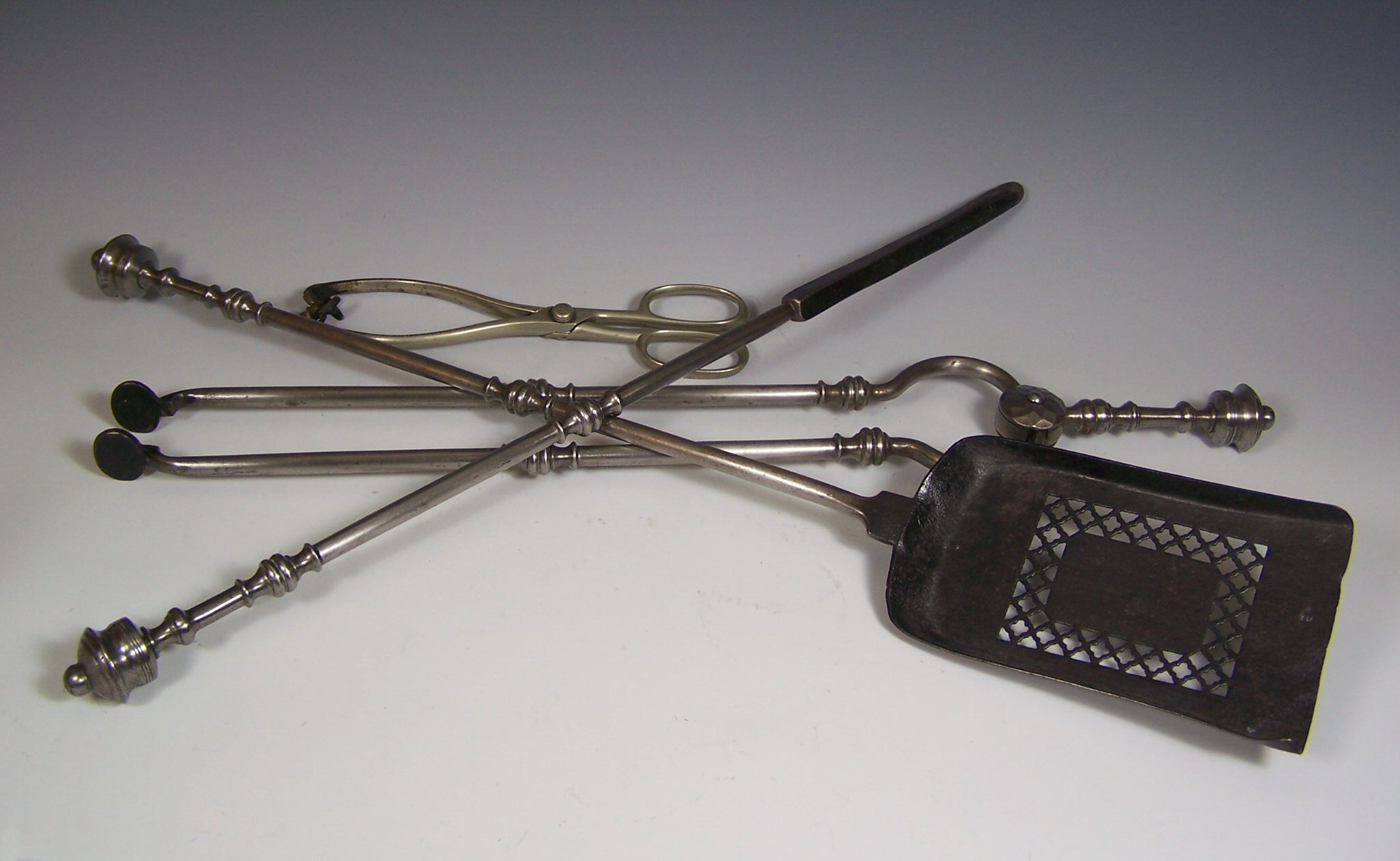 A set of three fire irons,