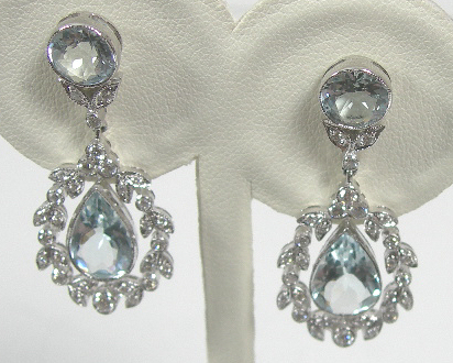 A pair of aquamarine and diamond pendant earrings,