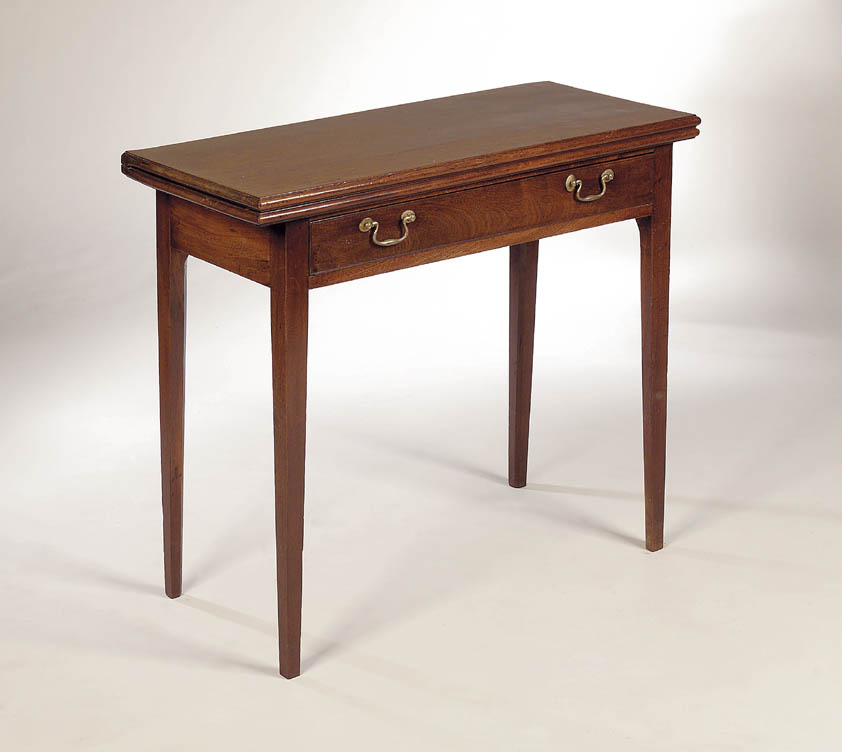 A George III mahogany foldover tea table,