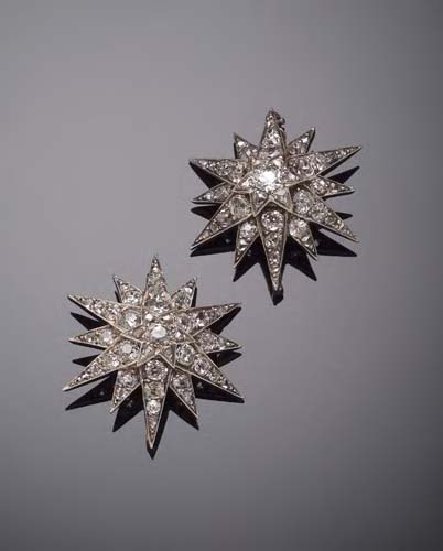 A pair of Victorian diamond set star brooches,
