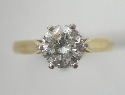 An 18ct gold mounted diamond single stone ring,