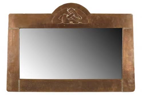 Archibald Knox (1864-1933) A copper-framed wall mirror,