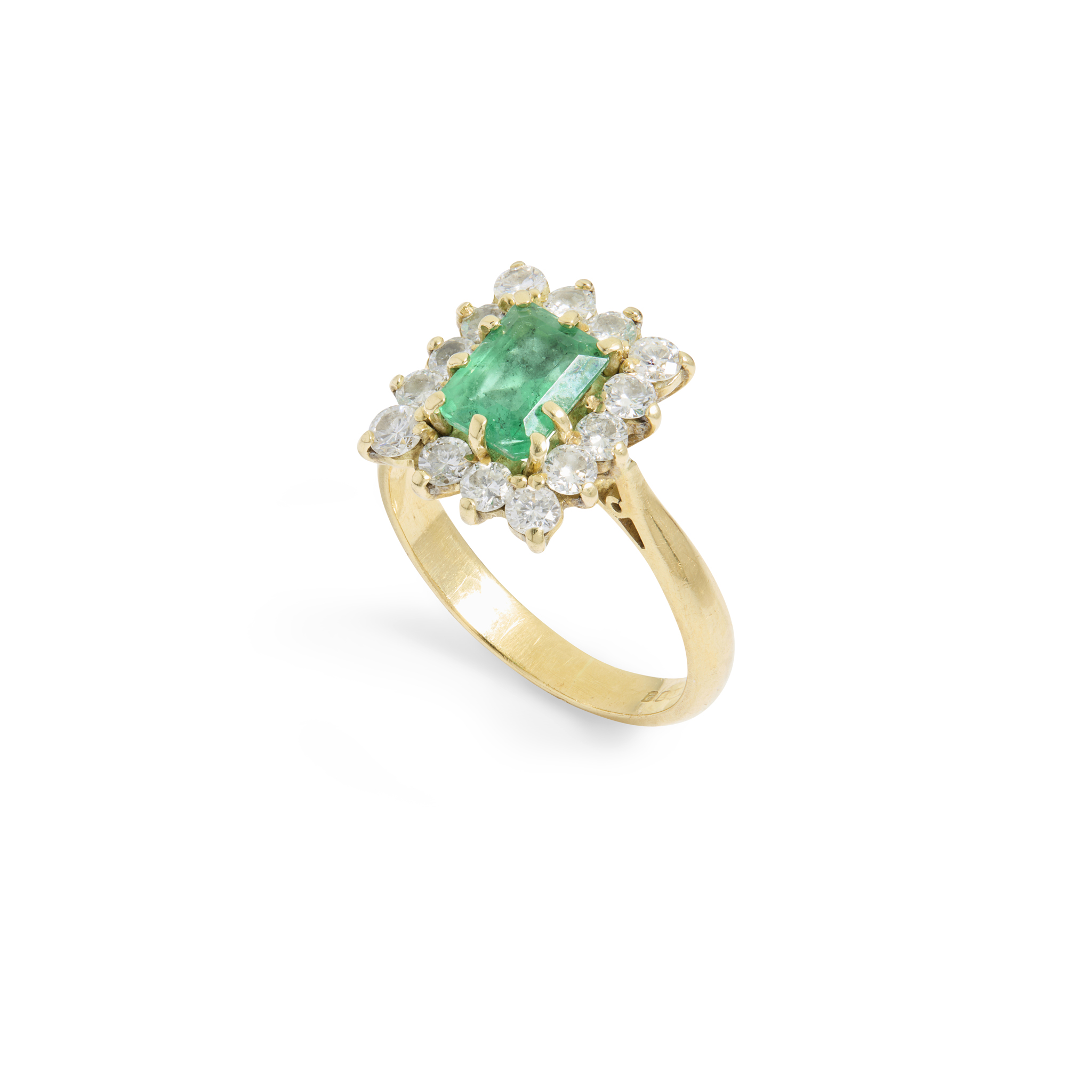 An 18ct gold emerald and diamond cluster ring