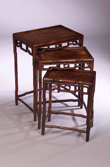 A nest of three Chinese hardwood occasional tables