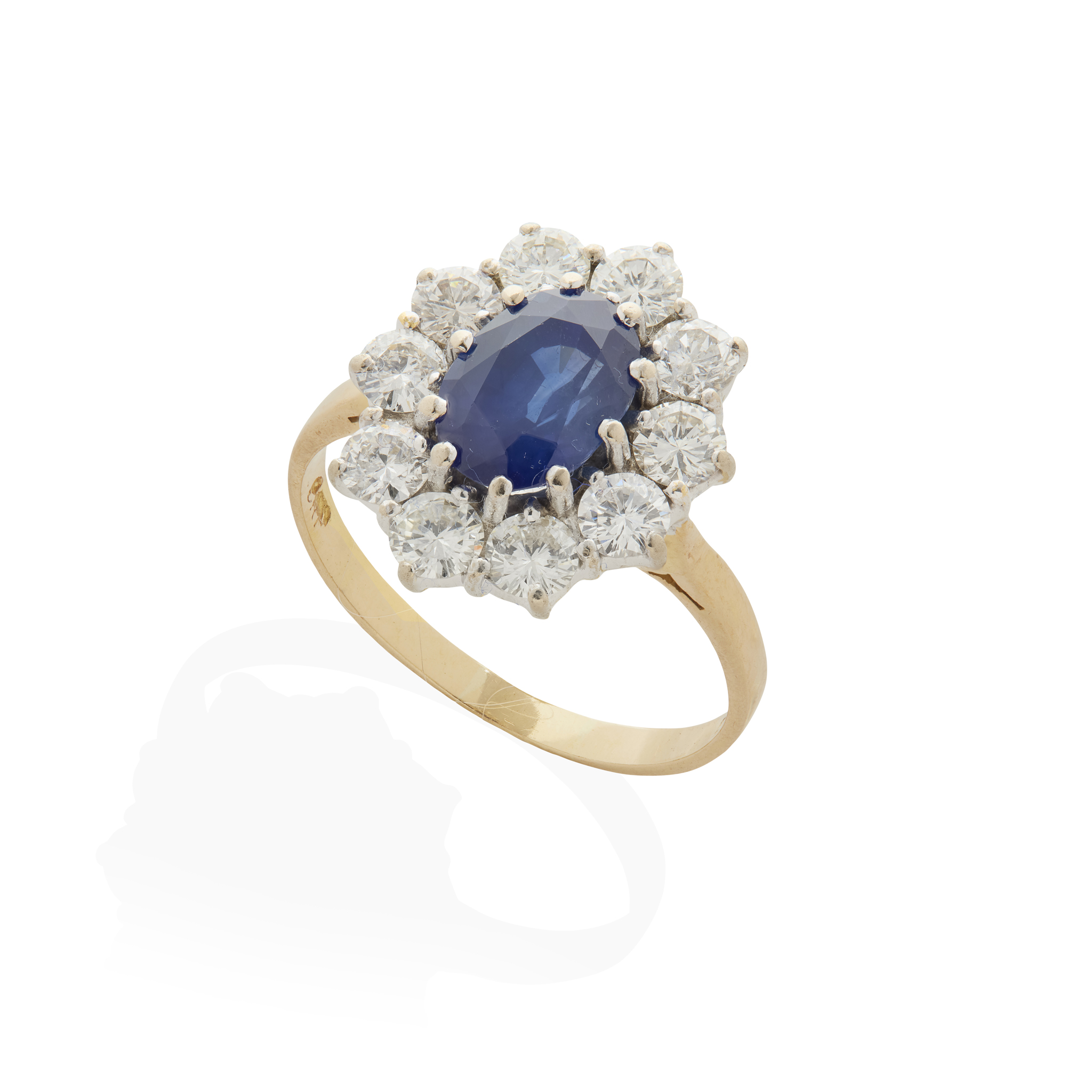 An 18ct gold sapphire and diamond cluster ring