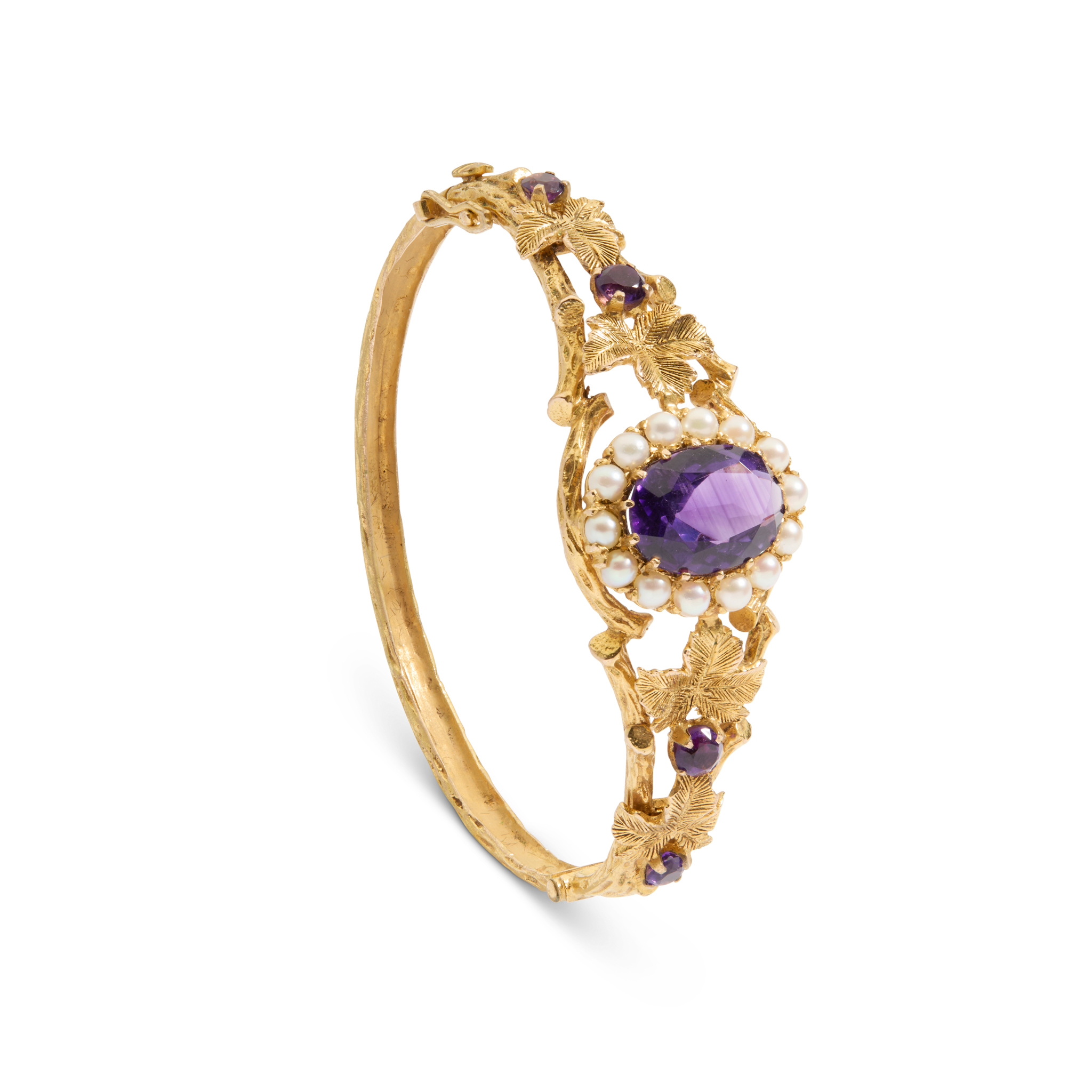 A 9ct gold amethyst and pearl bangle