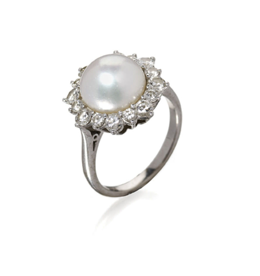 An 18ct gold and platinum mounted pearl and diamond cluster ring,