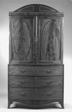 A George III mahogany bowfront linen press
