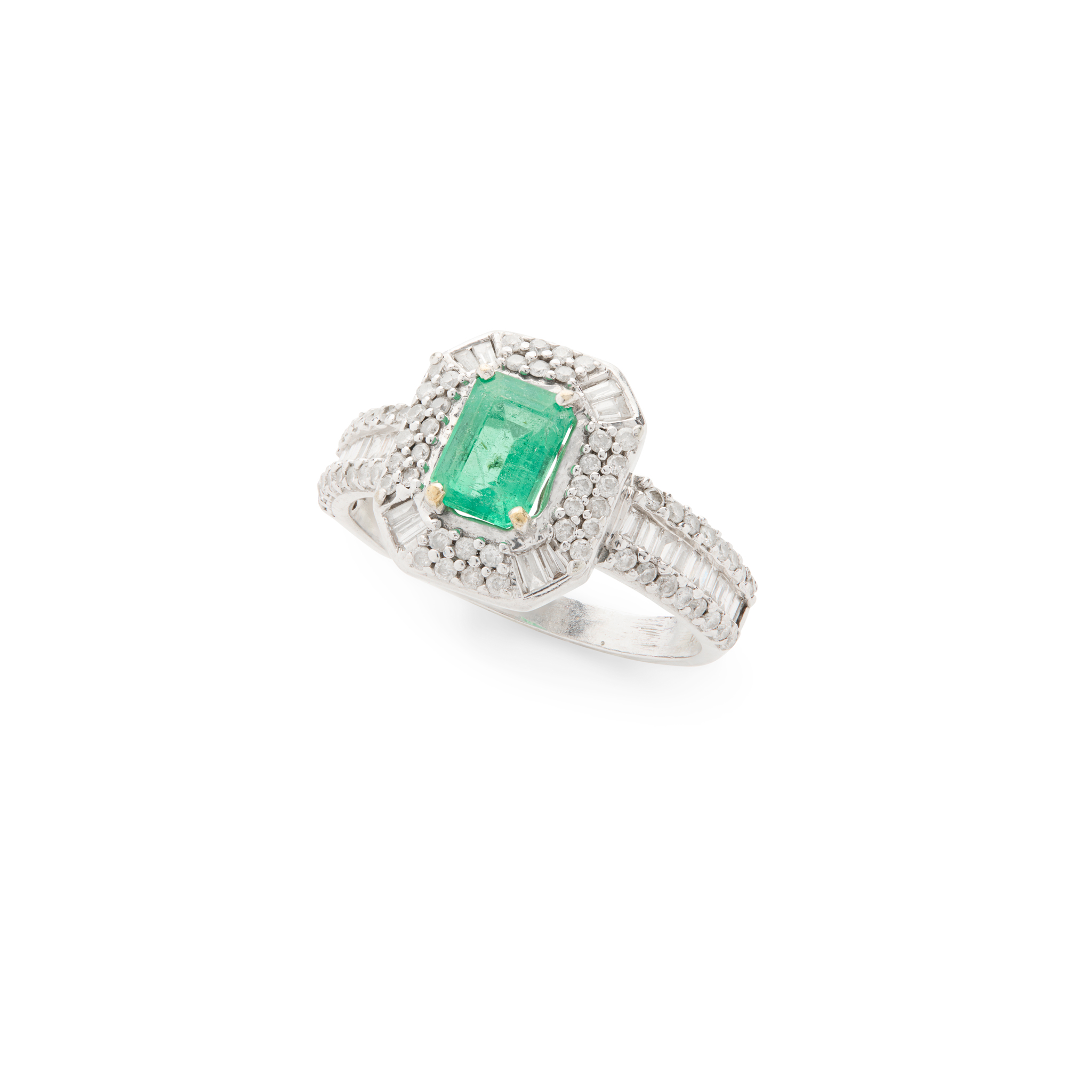 An emerald and diamond cluster ring