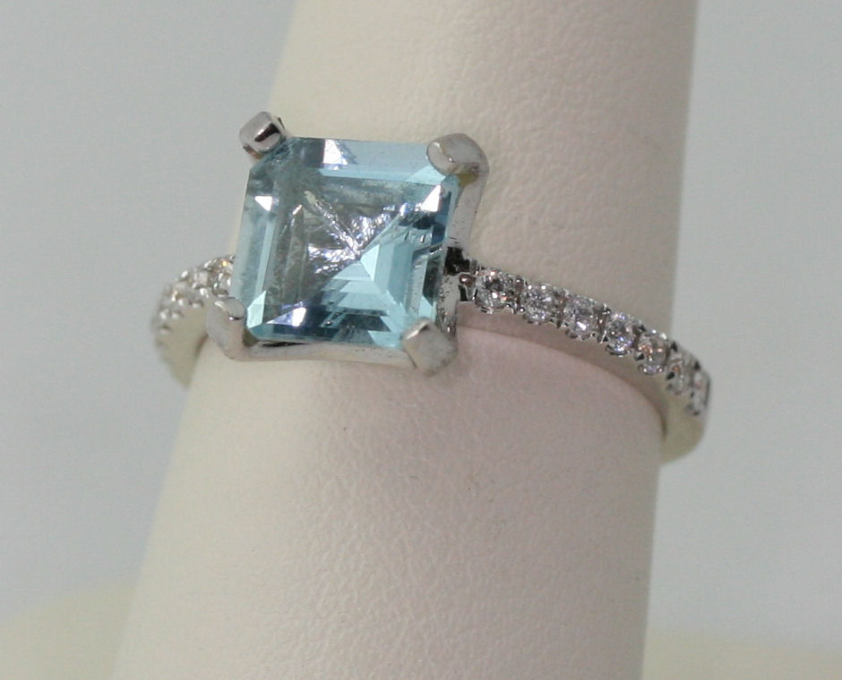 An aquamarine and diamond set ring