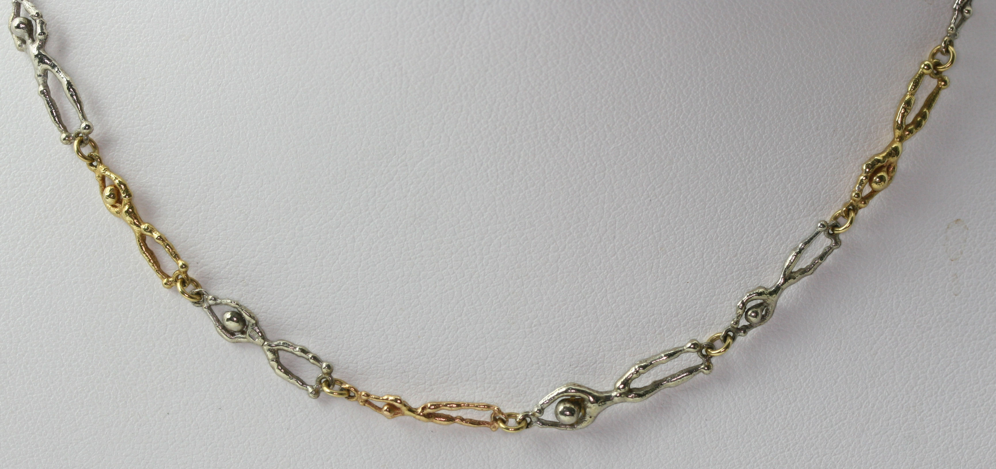 STUART DEVLIN - a 1970's 18ct two-coloured gold fancy link necklace