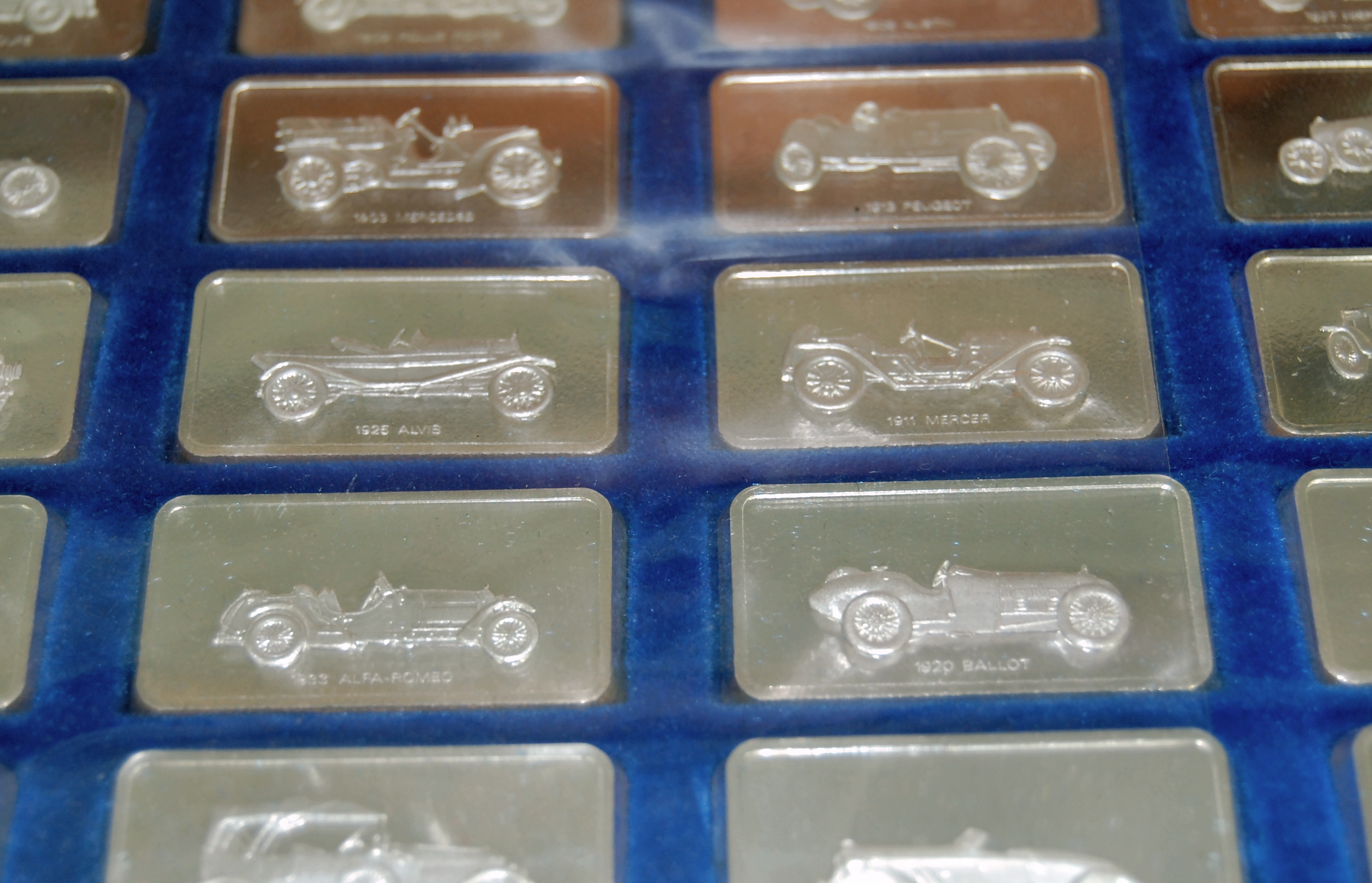 A cased set of silver ingots