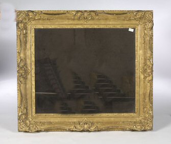 A gilt gesso rococo carved wall mirror