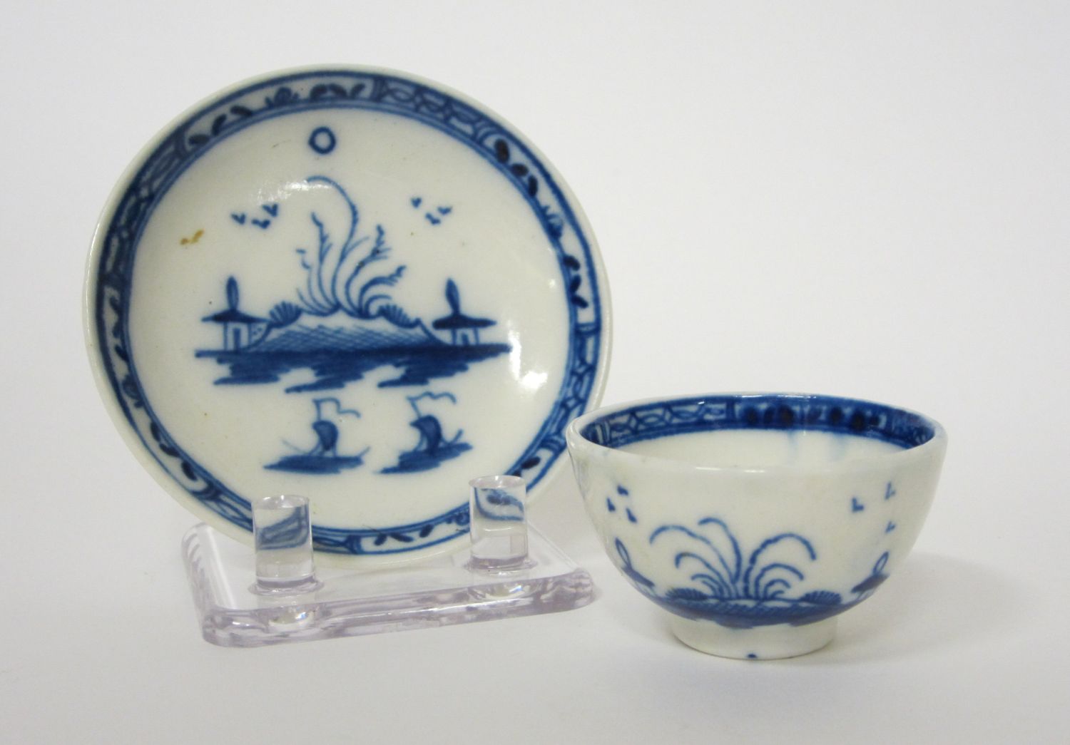 MINIATURE CAUGHLEY BLUE AND WHITE TEA BOWL AND SAUCER