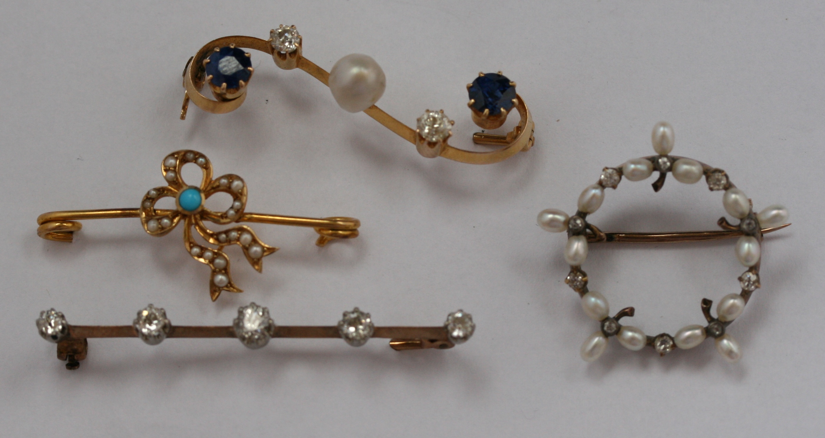 An early 20th century sapphire, pearl and diamond bar brooch