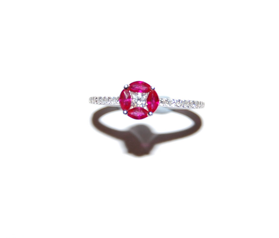A ruby and diamond floral cluster ring