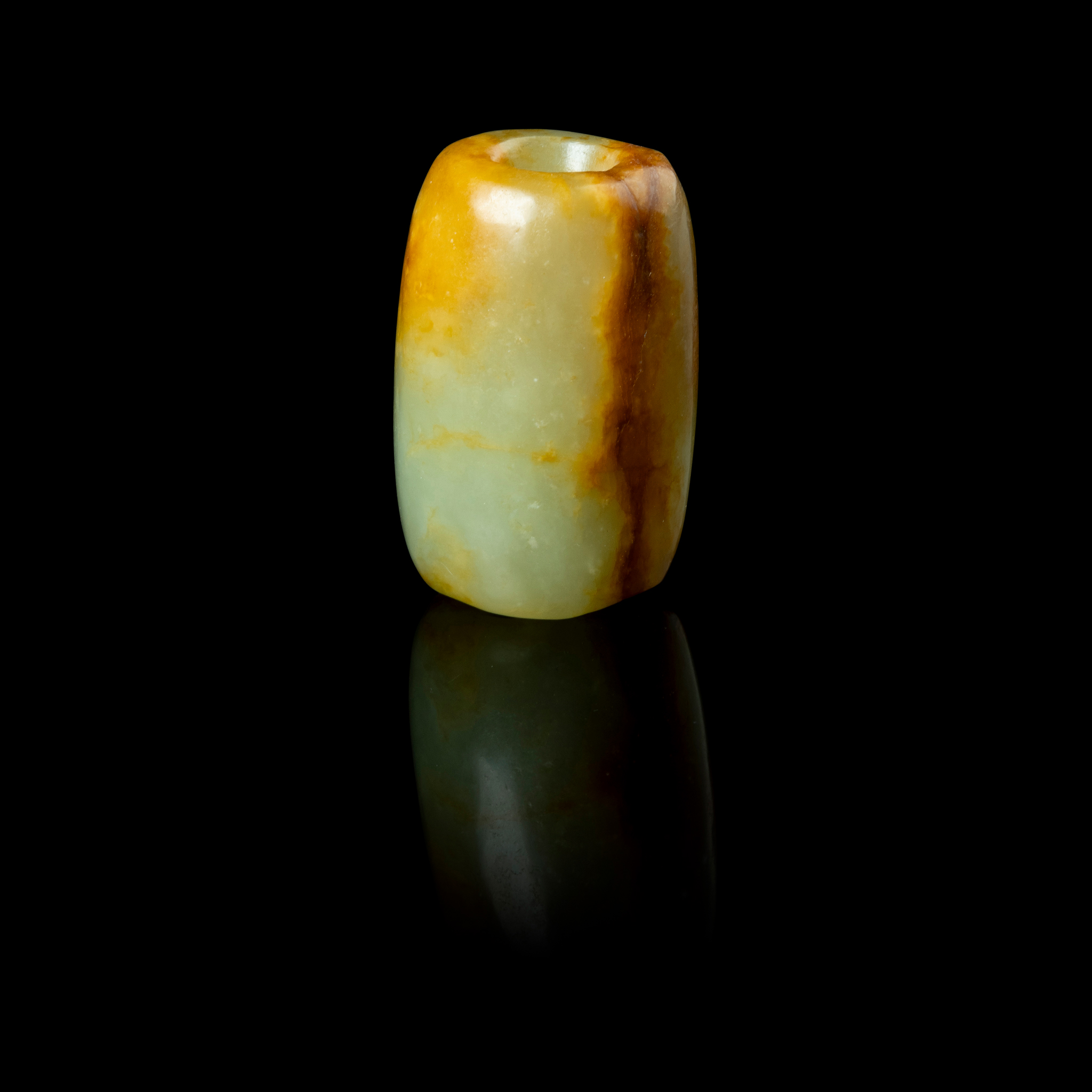 CHINESE CELADON WITH RUSSET INCLUSIONS JADE BEAD