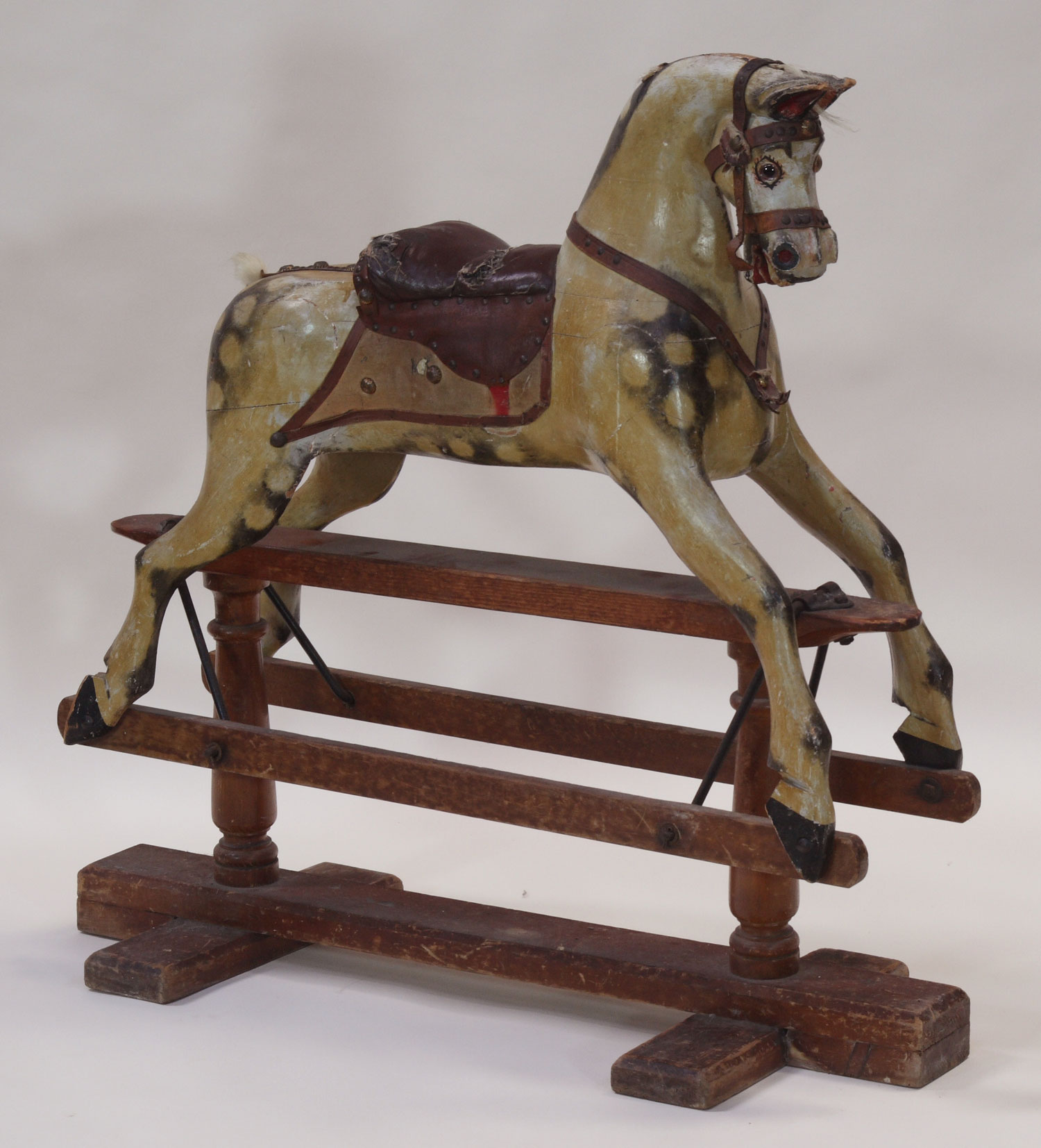 A painted rocking horse, circa 1900