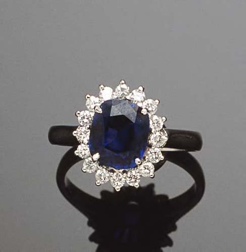An 18ct white gold mounted sapphire & diamond cluster ring,
