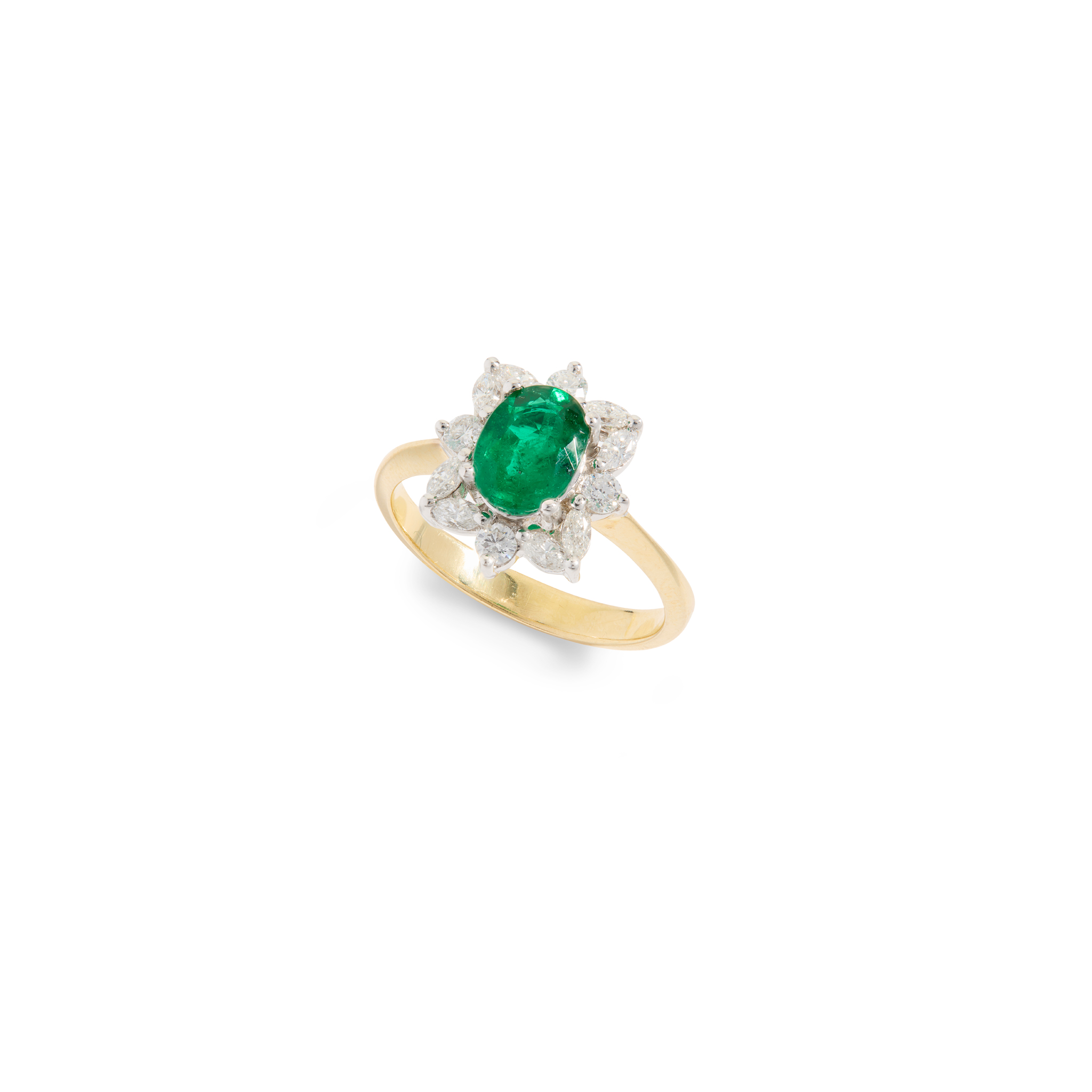 An emerald and diamond cluster ring