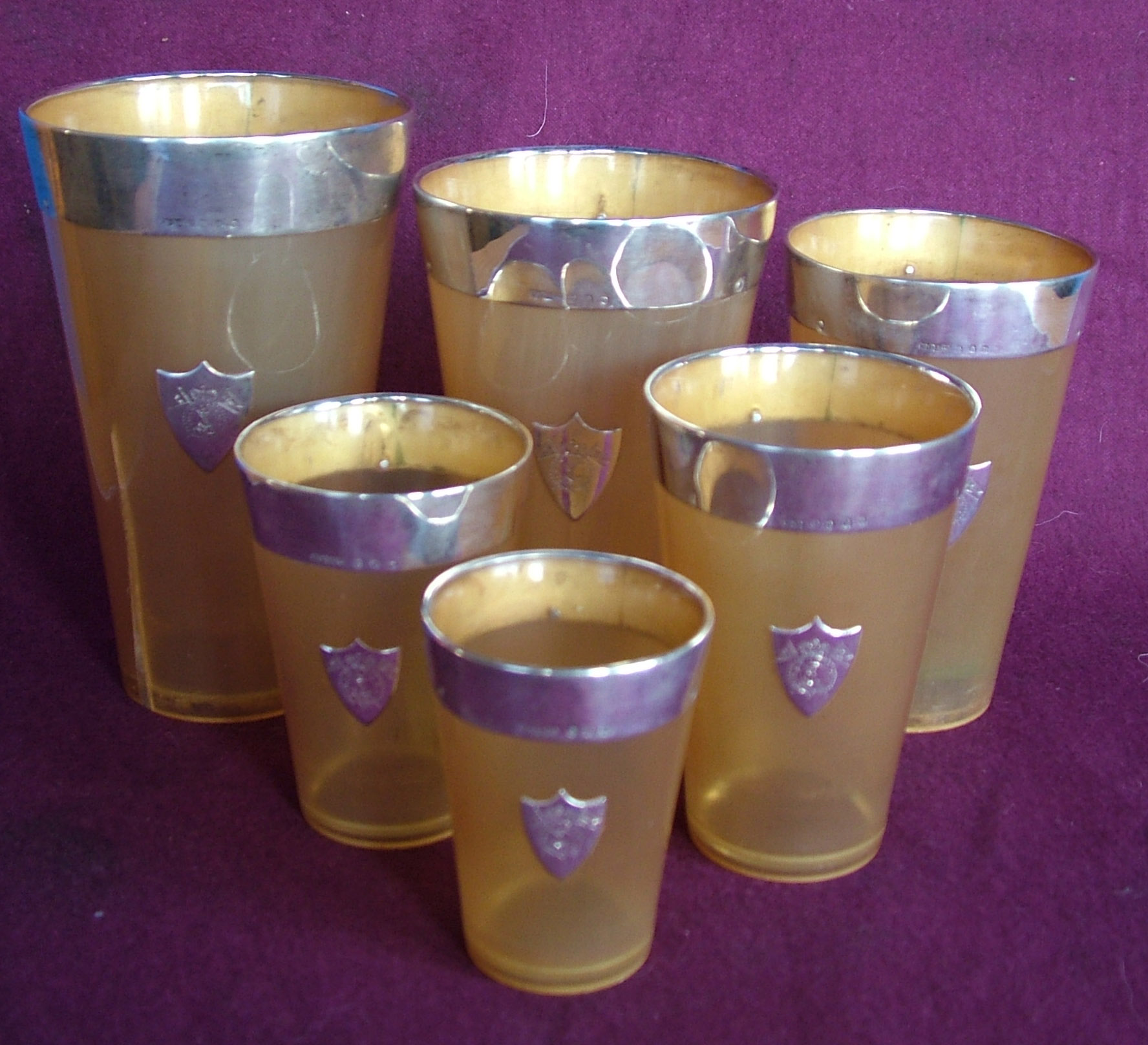 ABERDEEN - a scarce set of six mounted graduated horn beakers,