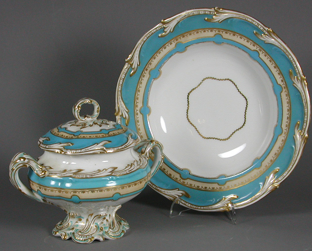 A Victorian Rococo decorated china part dinner service