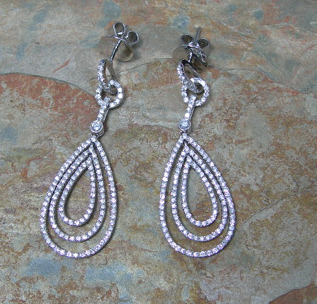 A pair of diamond pendant earrings,