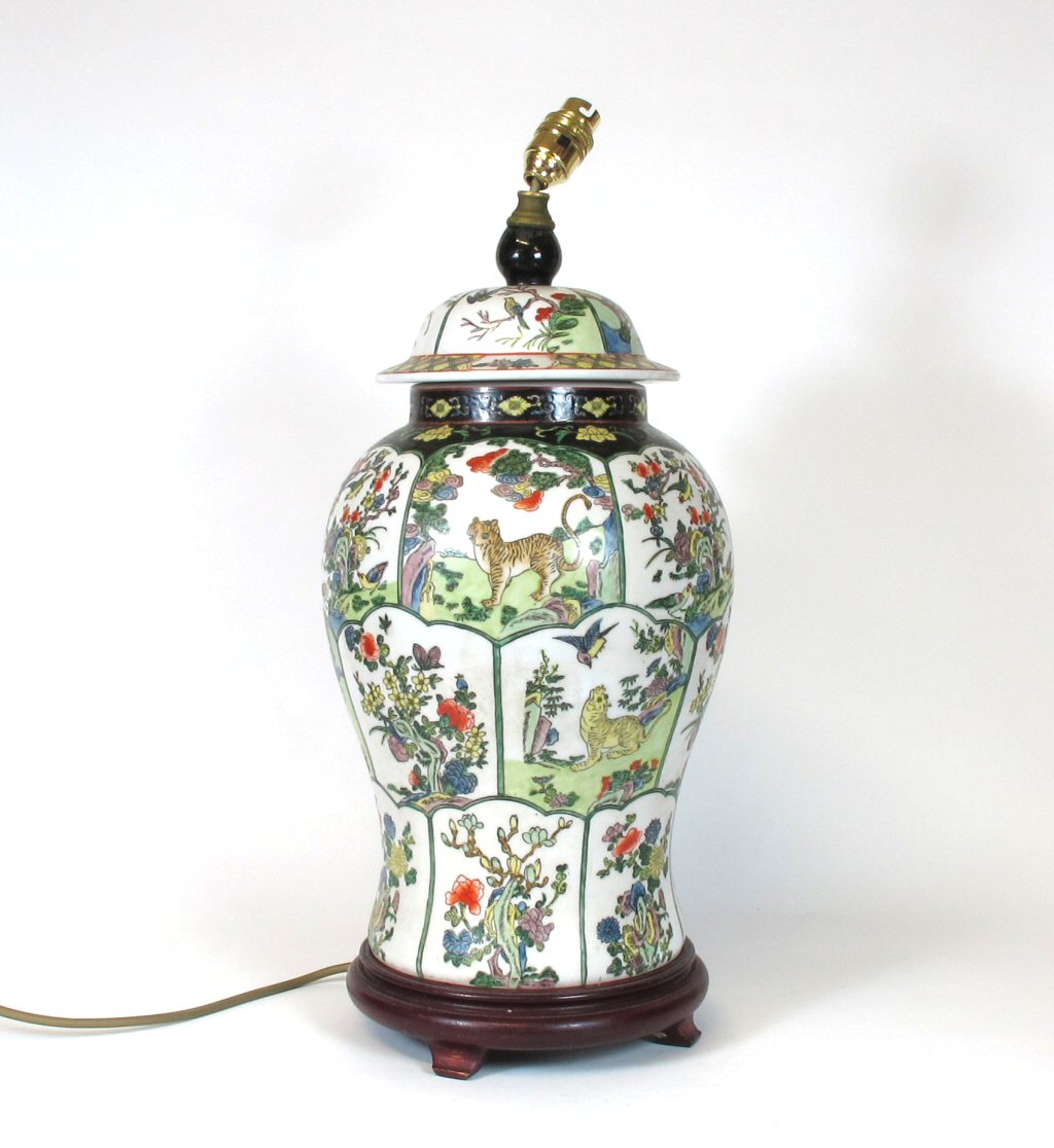 A large 19th century Chinese famille verte vase and cover