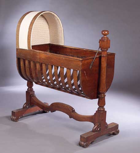 A Victorian mahogany cradle,