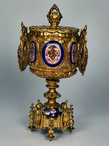 A Russian gilt metal and porcelain mounted Renaissance style cup and cover probably circa 1900