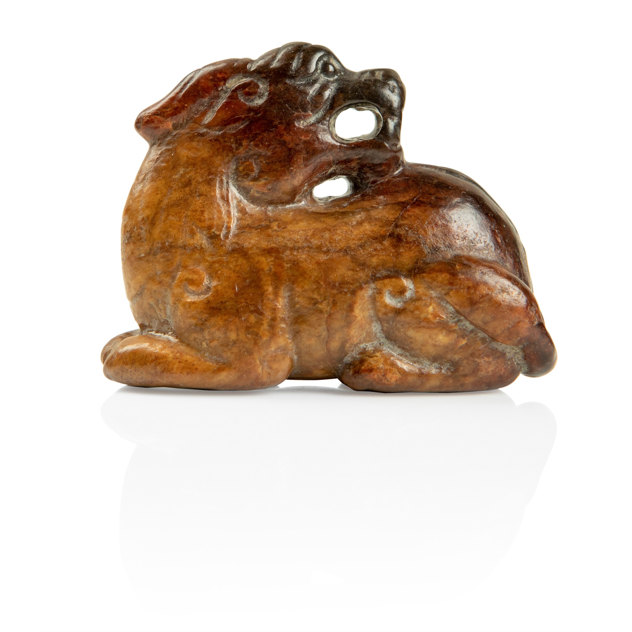 RUSSET JADE CARVING OF A MYTHICAL ANIMAL