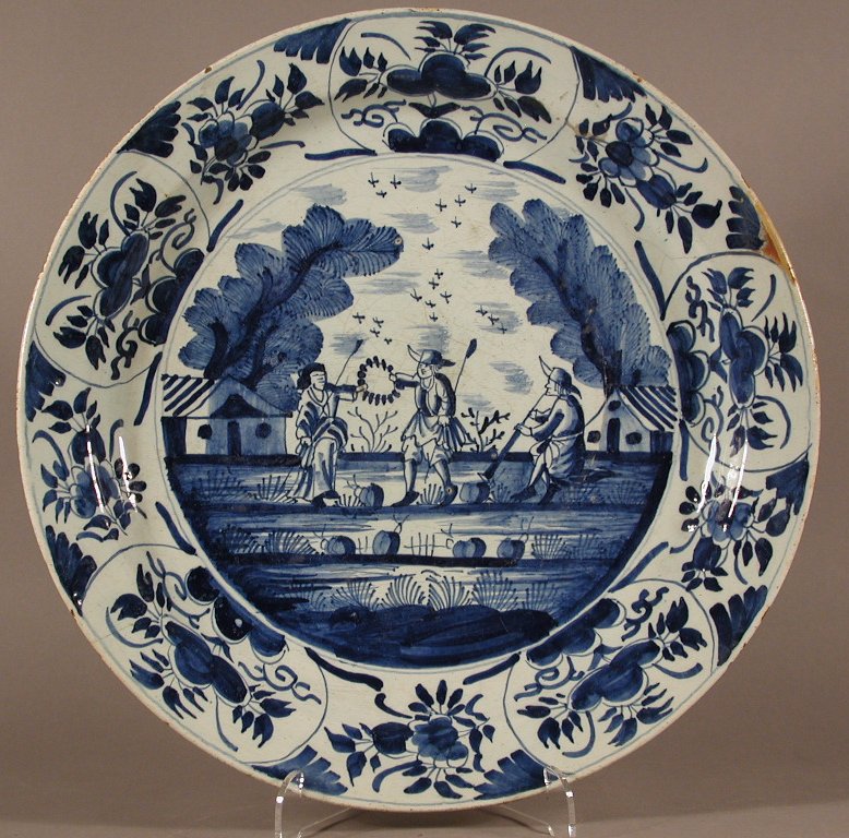 A pair of blue painted Dutch shallow bowls