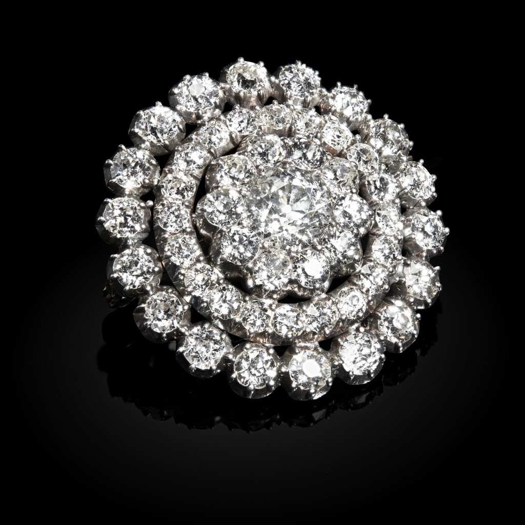 A late 19th century diamond set cluster brooch