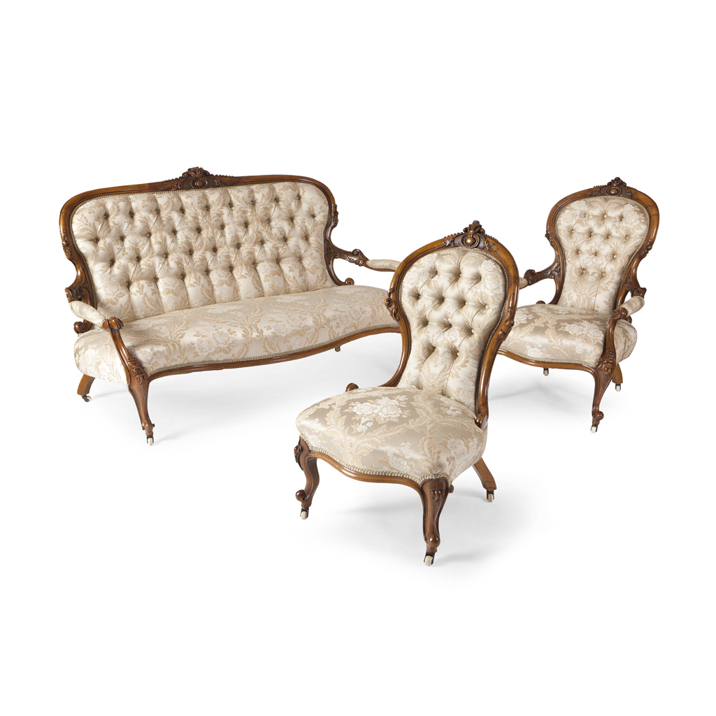 A VICTORIAN WALNUT AND UPHOLSTERED THREE PIECE PARLOUR SUITE