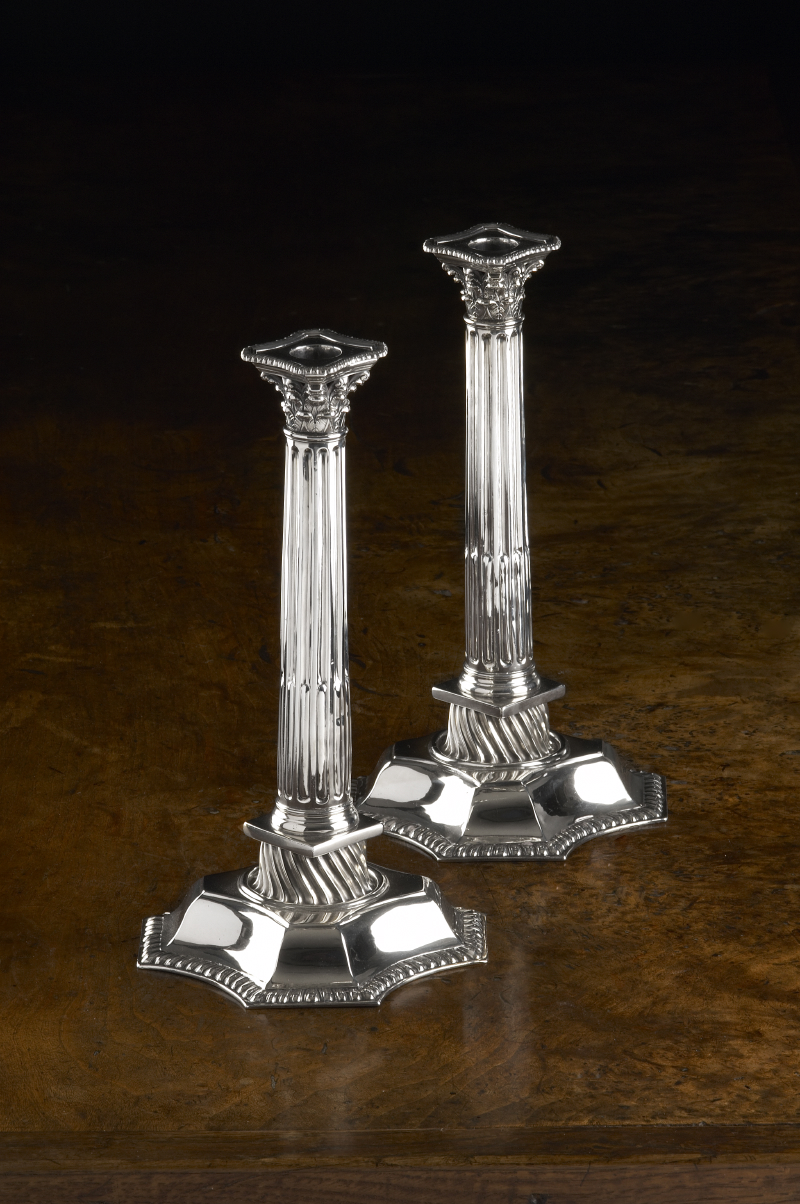 A pair of George II Scottish silver table candlesticks