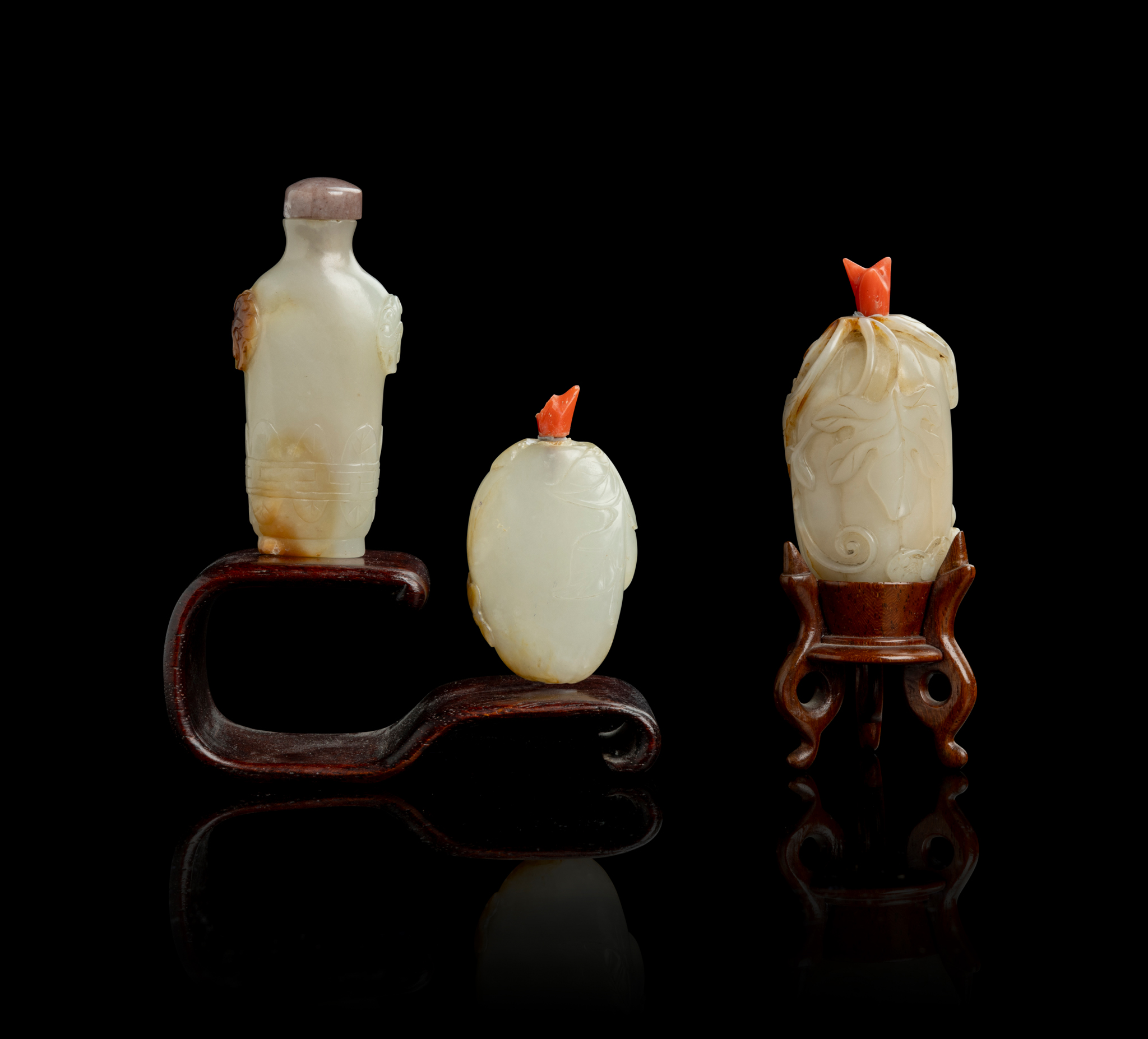 GROUP OF THREE PALE CELADON JADE SNUFF BOTTLES