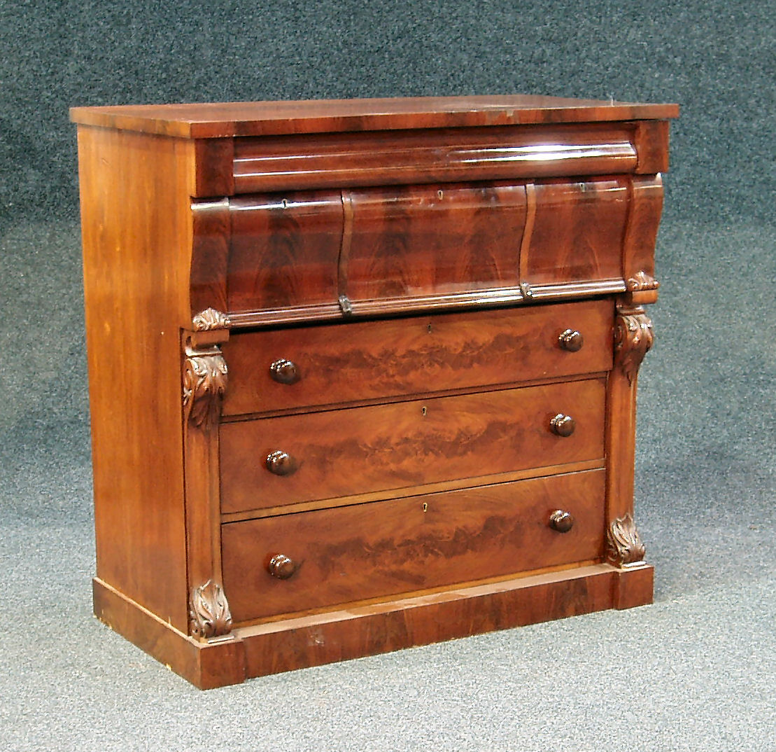 A Victorian feathered mahogany column chest
