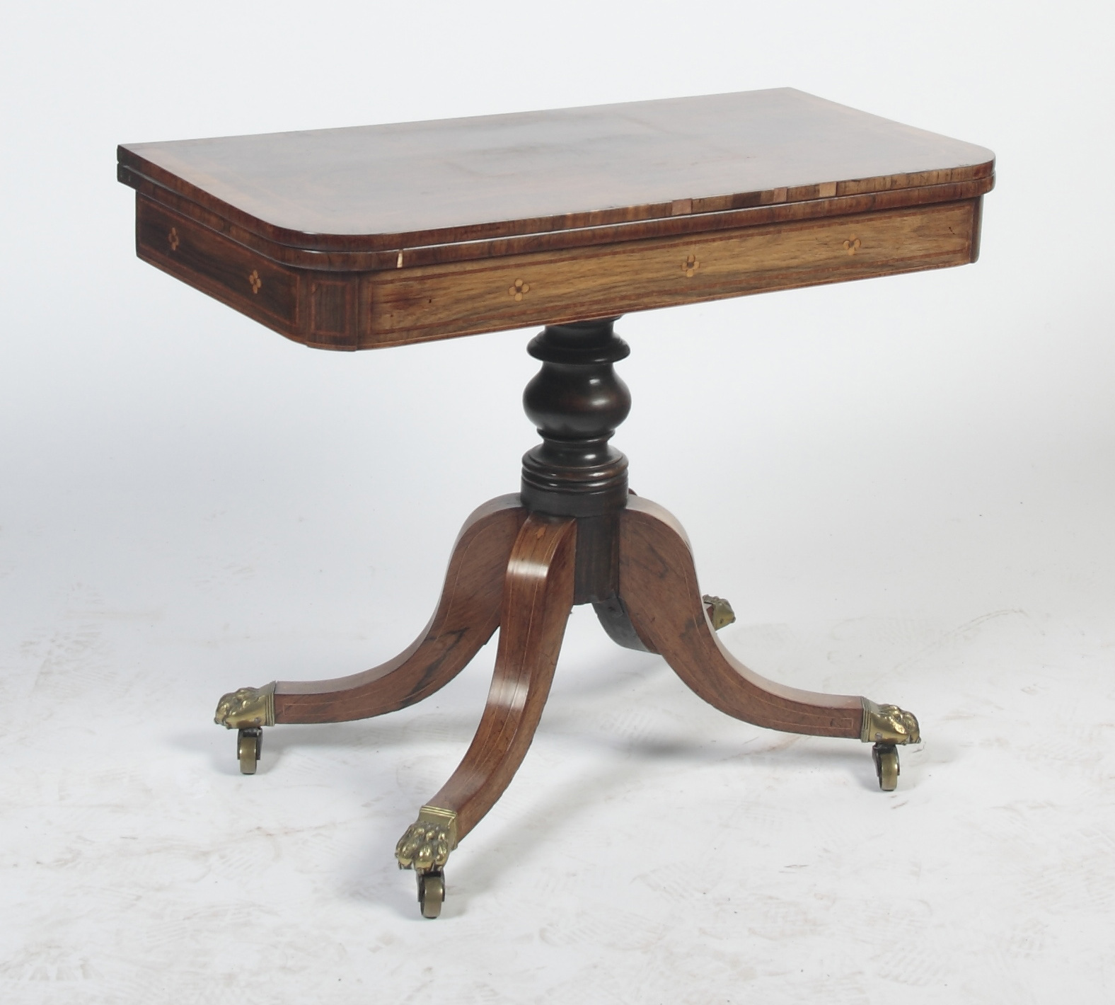 A Regency rosewood and crossbanded games table